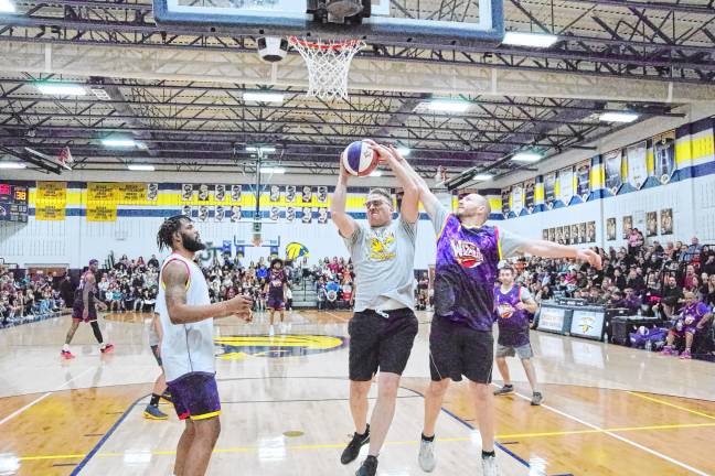 State Assemblyman Christian Barranco, D-25, grabs the ball during a rebound. He played for the Jefferson team.