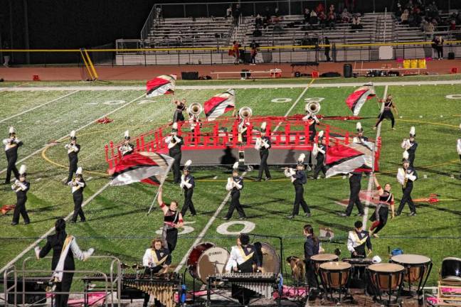 <b>The Vernon Township High School Marching Band and Color Guard perform during halftime Oct. 11.</b>