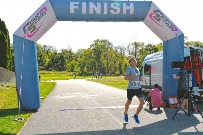 Kyle Morsell, 17, of Branchville wins the 5K with a time of 20:41.91.