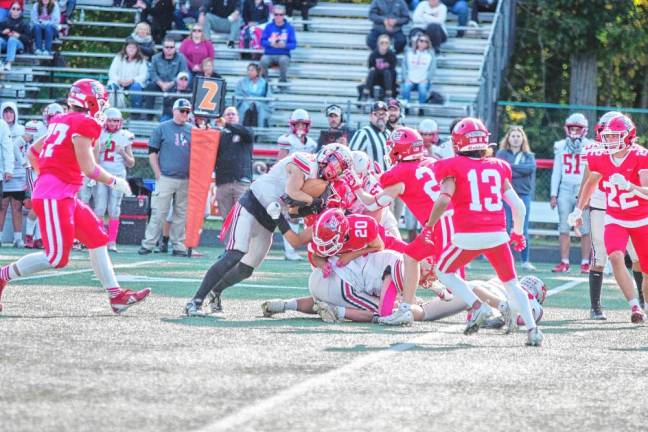 <b>High Point ball carrier Jerron Martress' progress is stopped by the Lenape Valley defense on a play. Martress rushed for 153 yards.</b>