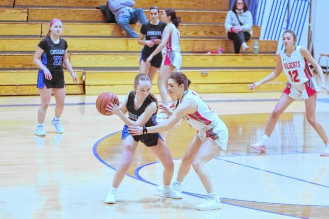 KT3 Kittatinny’s Holly Sajdak holds the ball while covered by High Point’s Grace Elston. Sajdak grabbed two rebounds and is credited with one assist and one steal.