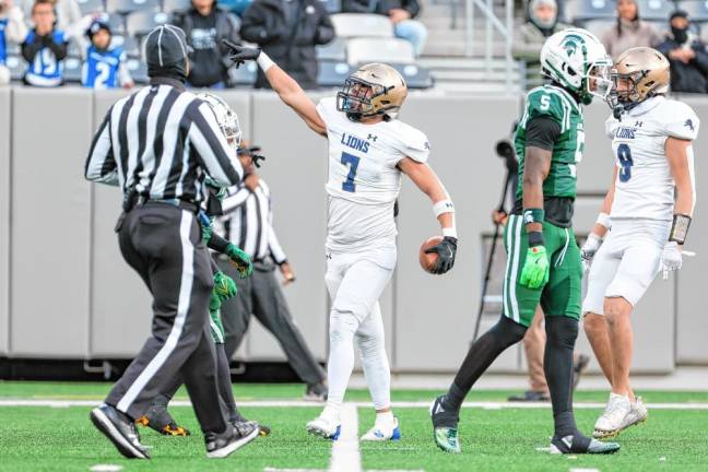 Nick Struble signals first down for the Lions after his 32-yard reception in the first quarter.