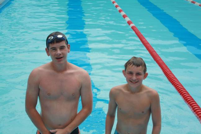 Eric Vincelette, age 14 and WIll Englehardt, age 13 swim over 100 laps each.