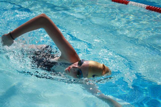 Mikayla Flanz of the Lake Mohawk Hawks completing laps at last Friday&#x2019;s swim-a-thon fundraiser for Pass It Along.