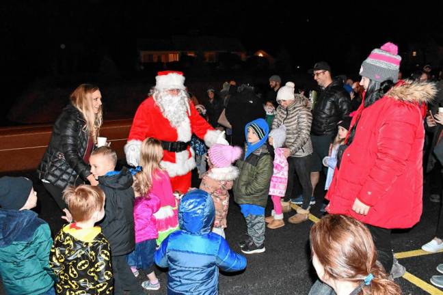 Santa greets the crowd in Byram.