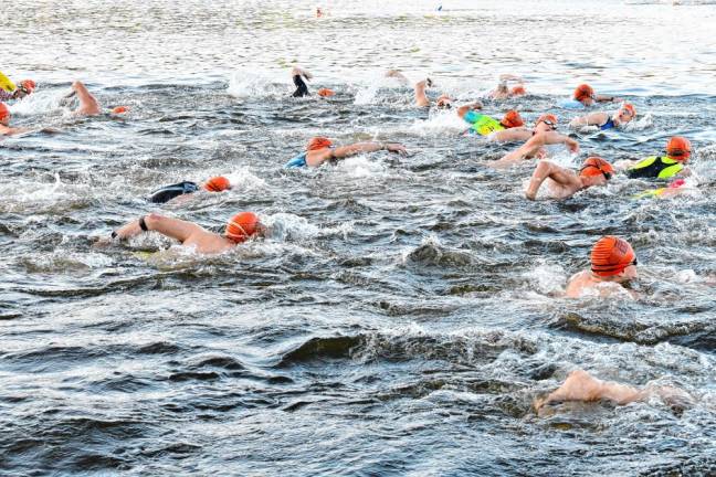 Swimmers begin the first leg of Pass It Along’s Triathlon on Saturday, July 27 at Lake Mohawk in Sparta. (Photos by Maria Kovic)