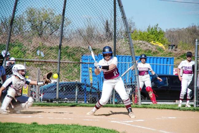 Newton batter Jordyn Young watches the ball pass home plate. She scored one run.