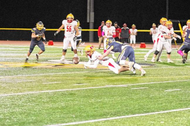 <b>Mount Olive wideout Vincent Carpini (12) is unable to hang onto the ball after being hit by Vernon linebacker Chase MacLean in the second quarter.</b>