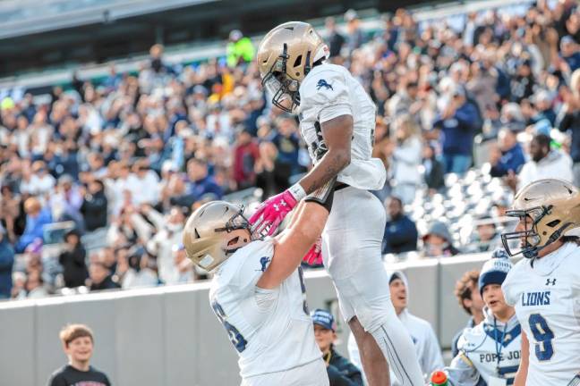 Tylik Hill is lifted up in celebration after he makes a touchdown against DePaul.