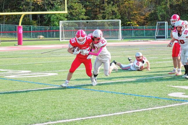 <b>Lenape Valley ball carrier Jakob Bell is tackled by High Point defensive back Brendan Lehman late in the second half.</b>