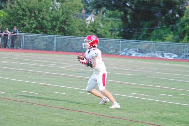 <b>Lenape Valley kick returner Trey Moodie catches the ball in the first half.</b>