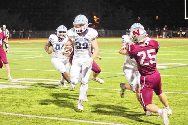 <b>Sparta running back Brady Shagawat moves the ball forward in the first half. He rushed for 116 yards and scored one touchdown. He also caught one touchdown pass.</b>