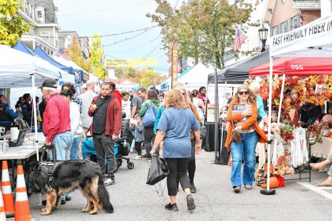 People fill Spring Street during the annual Fall Festival in Newton on Sunday, Oct. 13. (Photos by Maria Kovic)