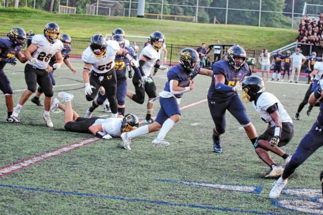 <b>Jefferson ball carrier Braedan Cummings finds some running room during a play.</b>