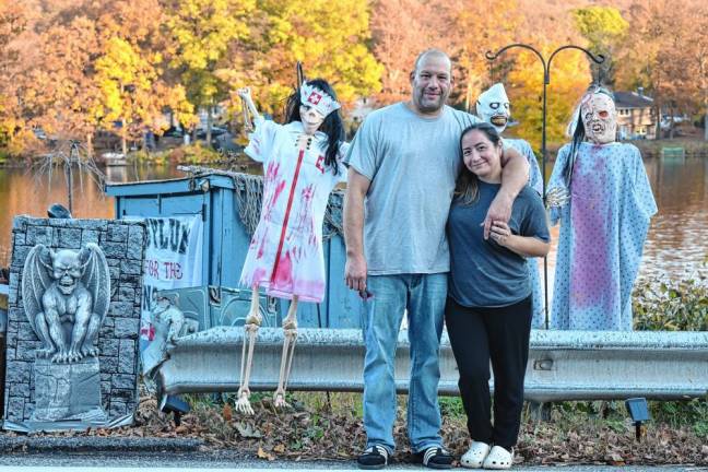 Joey Santiago with his wife, Kimberly Marquez, who has lived in the same home at the northern end of Clinton Road her entire life. Twice she has seen the phantom car headlights at night. (Photos by Rich Adamonis)