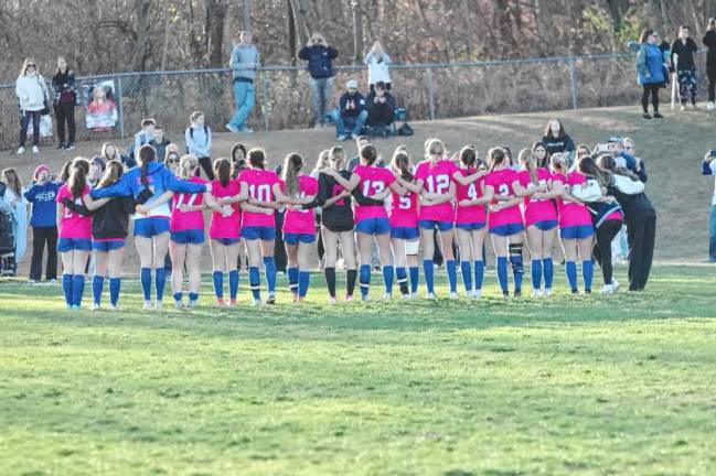 The victorious Kittatinny Cougars and support staff pose for a portrait.