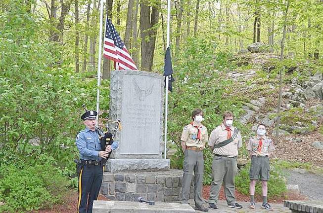 Byram Ptl. Todd Sodano, Sgt. Tom Dellicker and Chief Kenneth Burke salute as the flag is raised. (Photo provided)