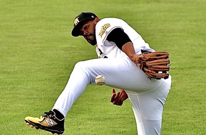 Jackson Valera tosses the ball under his leg.