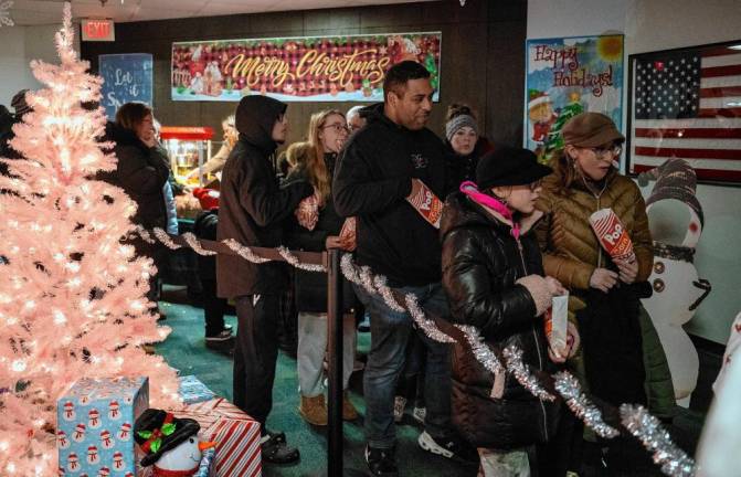 Residents line up to take photos with Santa.