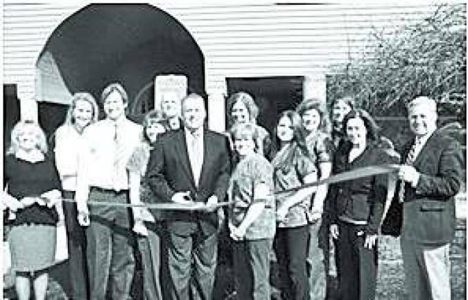 Photo Provided Andover Mayor Michael Lensak, Dr. Michael T. Ward, along with his family and staff, cut the ribbon at their new location, 61 Newton-Sparta Rd. in Andover.