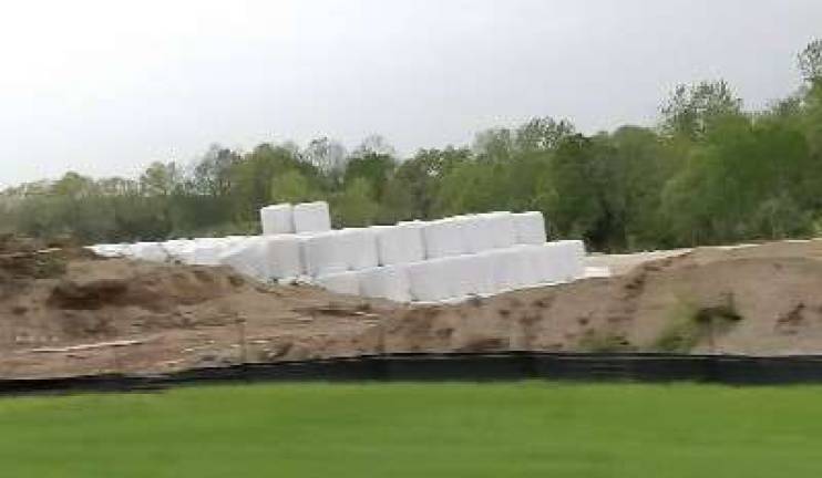 Bales of recycled glass materials rest on the site of future Pace Glass Recycling, Inc. processing facility on Limecrest Road