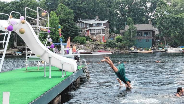 SS2 Cast members dive into the water during the opening number.