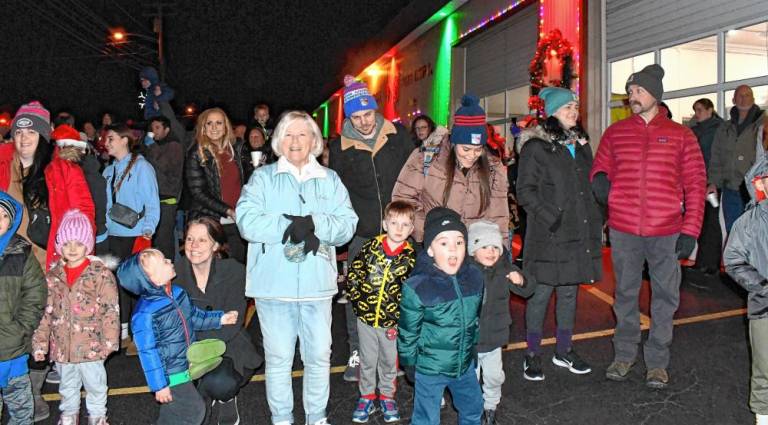 The crowd greets Santa.