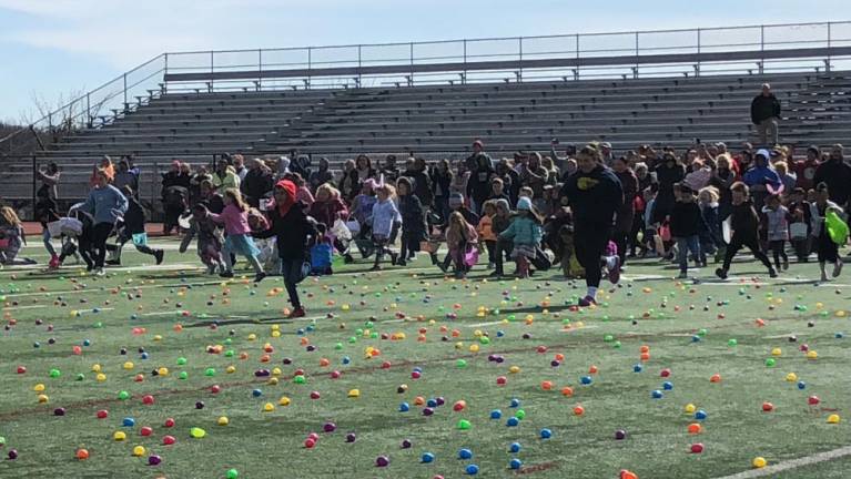 Between 2,500 and 3,000 plastic eggs were scattered on the field. Children were asked to take no more than 12 each.