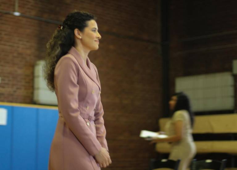 $!<b>Karla Mondloch walks up to receive her documents at a naturalization ceremony in Newburgh. Photo: Brianna Kimmel</b>